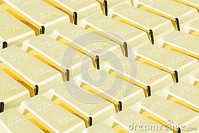 Stack of shiny gold bars / ingots in the central vault / storage room. Stock Photo