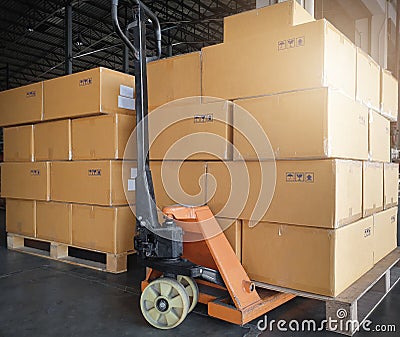 Stack of shipments boxes on pallet waiting for load into a truck. Road freight cargo industry. Stock Photo
