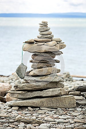 Stack stones on a pebble beach Stock Photo