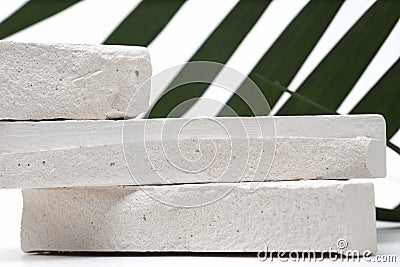 Stack stones platform podium, palm leaf on gray light copy spase background. Minimal empty display product presentation scene Stock Photo