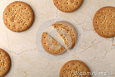 Stack of sweetmeal digestive biscuits closeup of a pile of biscuits on a texture background Stock Photo