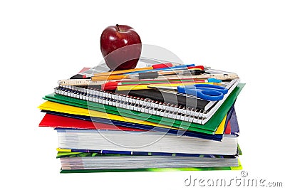 Stack of textbooks with school supplies on top Stock Photo