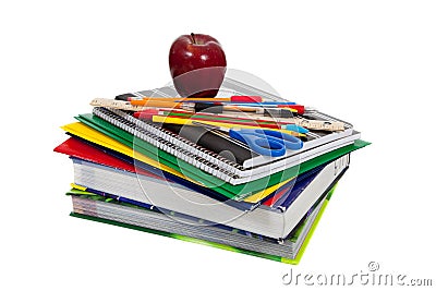 Stack of textbooks with school supplies on top Stock Photo