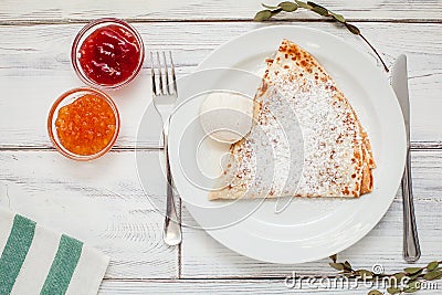 Thin pancakes with jam honey and sour cream and coffee Stock Photo