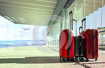 stack of traveling luggage in airport terminal and passenger plane flying for air transport and treveling theme Stock Photo