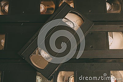 Stack of VHS video tapes as background. Old video cassettes tapes. Stock Photo