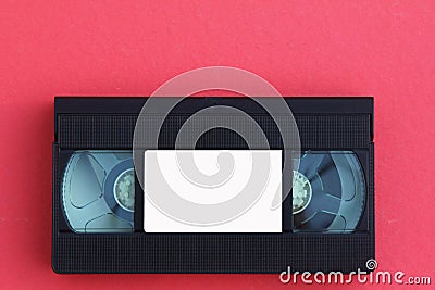 Stack of VHS video tapes as background. Old video cassette tapes. Retro technology. Stock Photo