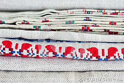 A stack of woven linen towels with embroidery, traditional handmade in Ukraine Stock Photo