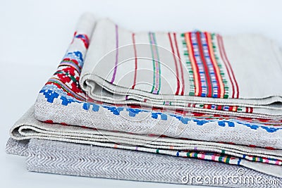 A stack of woven linen towels with embroidery, traditional handmade in Ukraine Stock Photo