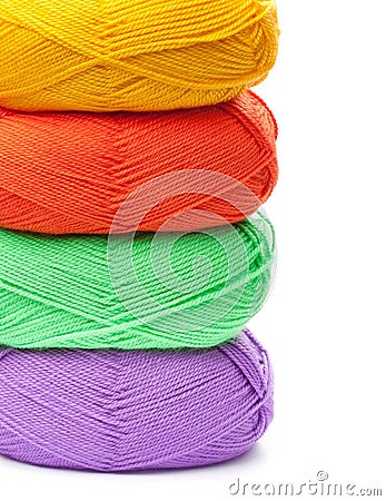 Stack of yarn skeins in red, yellow, green, purple colors Stock Photo