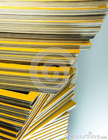 Stack of yellow monthly magazine Stock Photo