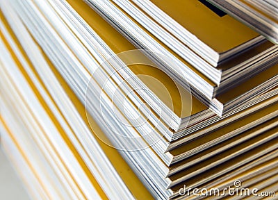 Stack of yellow monthly magazine Stock Photo