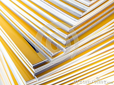 Stack of yellow monthly magazine Stock Photo