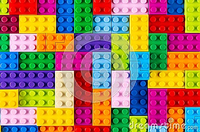 Stackable plastic toy bricks top view. Colorful texture childhood education and development concept background Stock Photo