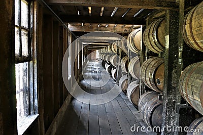 Stacked aging whiskey, scotch, bourbon barrels in Kentucky Stock Photo