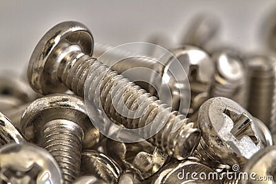 Stacked of chrome bolts Stock Photo