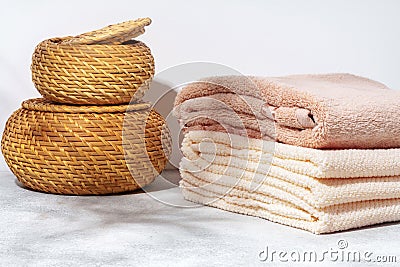 Stacked clean fluffy towels in a bathroom Stock Photo