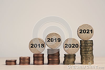 Stacked coins on a table, financial concept Stock Photo