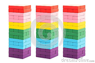 Stacked colorful wooden blocks toys on white background. Creative, diverse, expanding, rising or growing Stock Photo