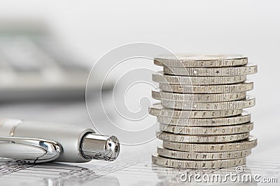 Stacked euro coins on table sheet Stock Photo