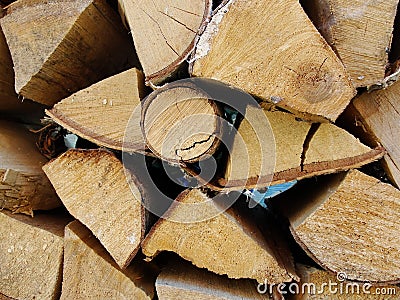 Stack of firewood, wood logs texture background.Pile of chopped fire wood prepared for winter Stock Photo