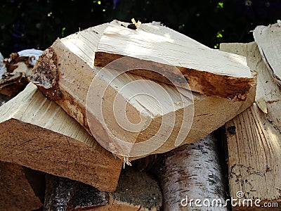 Stack of firewood, wood logs texture background.Pile of chopped fire wood prepared for winter Stock Photo