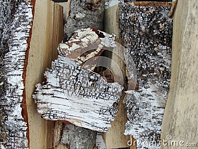 Stack of firewood, wood logs texture background.Pile of chopped fire wood prepared for winter Stock Photo