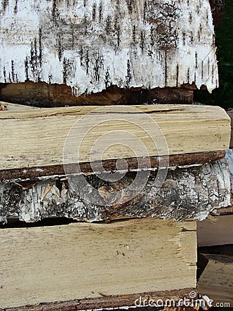 Stack of firewood, wood logs texture background.Pile of chopped fire wood prepared for winter Stock Photo