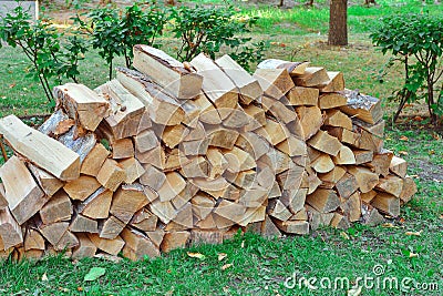 Stacked firewood in the village Stock Photo