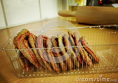 Stacked gingerbread cookies in a plastic cookie tray Stock Photo