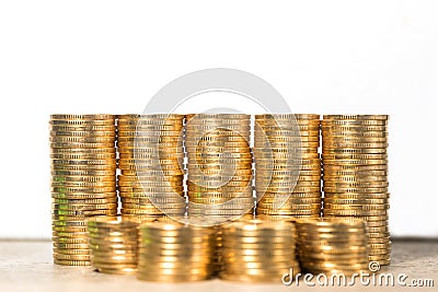 Stacked gold coins on white background Stock Photo