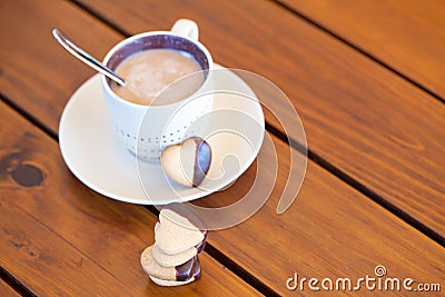 Stacked heart shaped cookies and cup of coffee, copyspace Stock Photo