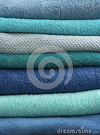 Stacked light blue bath towels Stock Photo