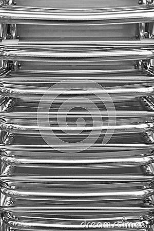 Stacked metallic chairs. Outdoors restaurant furniture. Urban ba Stock Photo