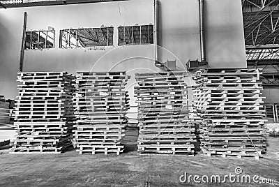Stacked pallets inside a warehouse. Industrial concept Stock Photo