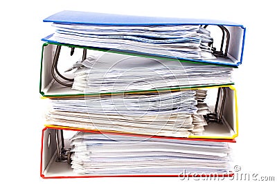 Stacked red, green, blue and yellow office folders Stock Photo