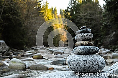 Zen stones stacked on river scene Stock Photo