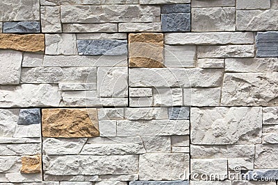Stacked stone wall, natural stone cladding. Stone wall for background,Slab stone wall texture. Wall background of volcanic Stock Photo