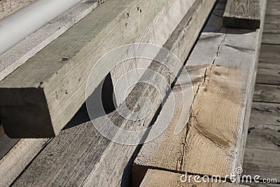 Stacked Timber and planking to be used to rebuild a working dock Stock Photo