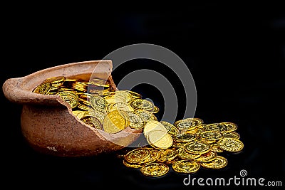 Stacking gold Coin in broken jar on black background, .Money stack for business planning investment and saving future Stock Photo