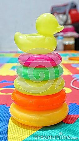 Stacking ring with duck cover is a game to train children's dexterity and motor skills Stock Photo