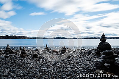 Stacking stones on pebble beach Stock Photo
