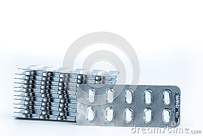 Stacks of anti allergy pills in blister packs isolated on white background. Pharmaceutical market. Cetirizine : antihistamine tabl Stock Photo