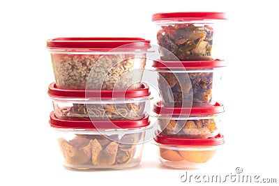 Boxes with Red Lids filled with Leftover Food Stock Photo