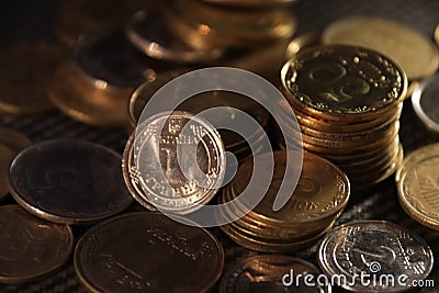 stacks of coins and chaotically scattered coins Stock Photo