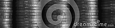 Stacks of coins close-up. Coin texture. Black and white business banner. Header made of many coin edges. Economy finance and Stock Photo