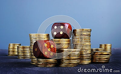 Stacks of coins and dices. Trading and uncertainty in business. Financial risk. Stock Photo