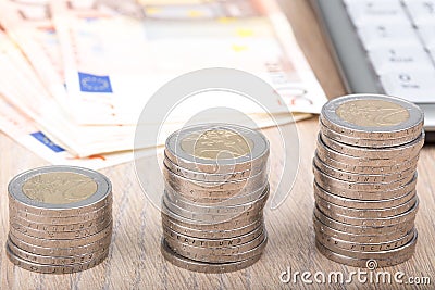 Stacks of coins increasing in size Stock Photo