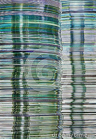 Data storage image with layered stacks of translucent metallic DVD and CD computer storage disks Stock Photo