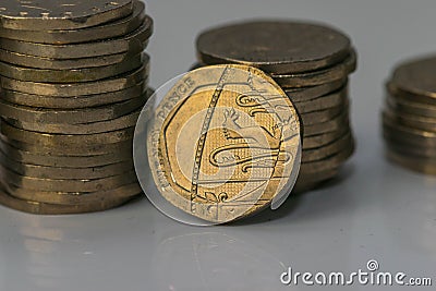 Stacks of different British coins on a white background. Stock Photo